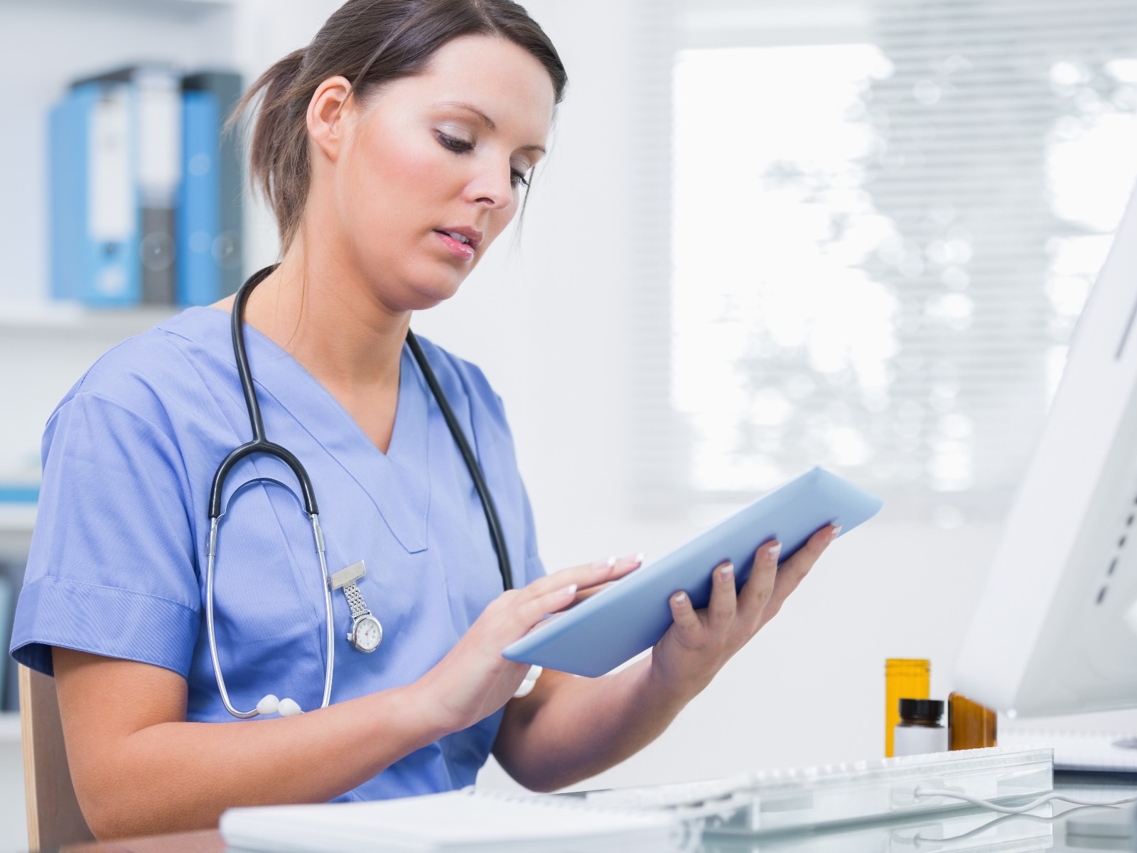 Nurse on a tablet computer