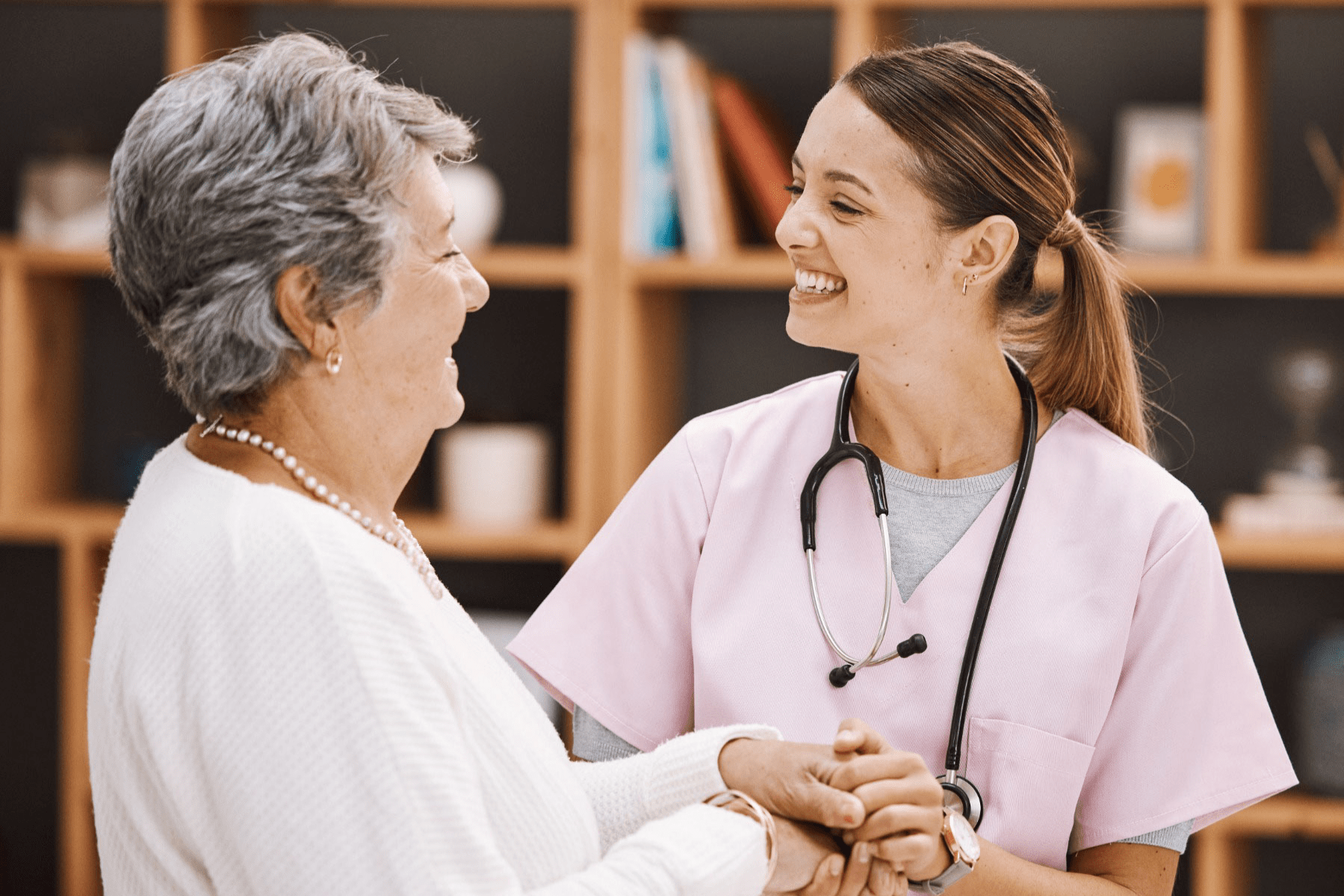 Nurse smiling at elderly patient